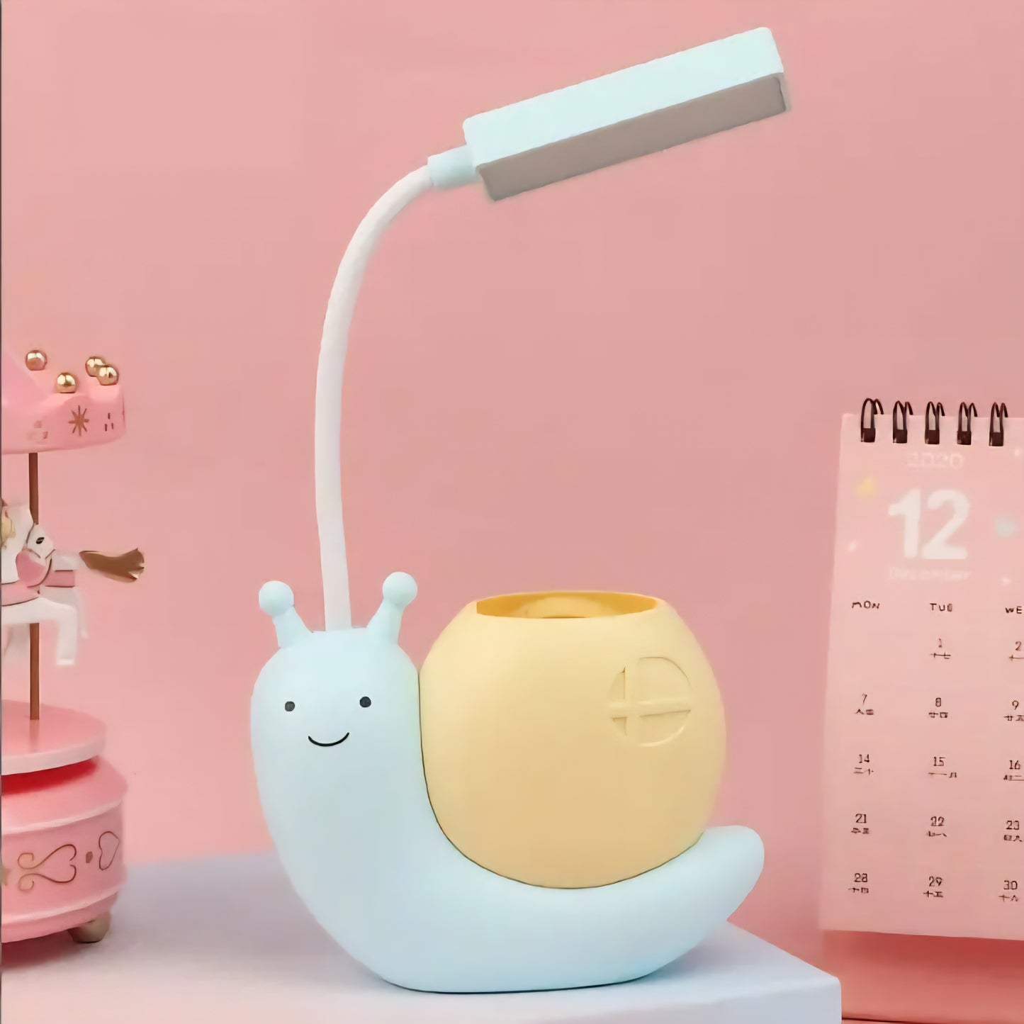 Brighten up your workspace with this adorable Cute Snail USB Charging Desk Lamp, designed to add a touch of whimsy and practicality to your desk. With its modern and simple style, this lamp serves not just as a light source but also as a charming pen holder, making it perfect for organizing your stationery while you work or study