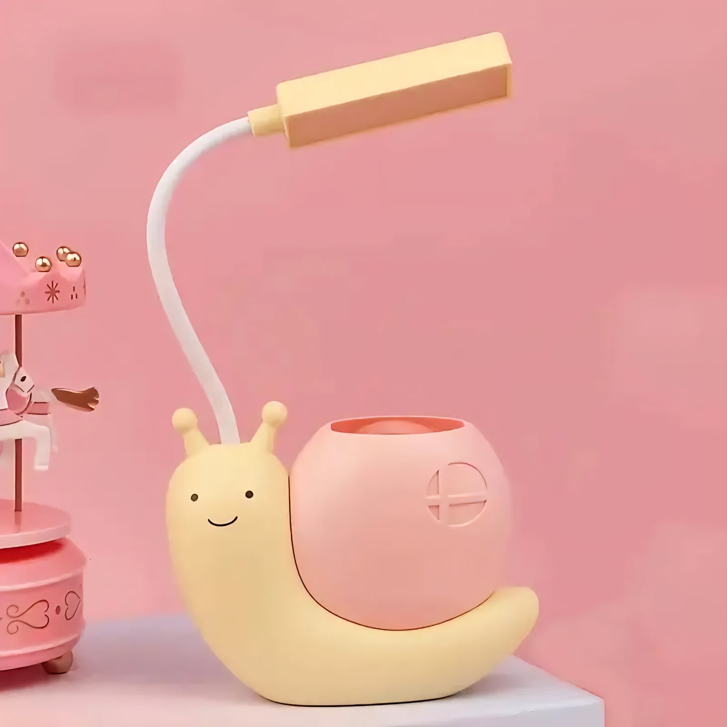 Brighten up your workspace with this adorable Cute Snail USB Charging Desk Lamp, designed to add a touch of whimsy and practicality to your desk. With its modern and simple style, this lamp serves not just as a light source but also as a charming pen holder, making it perfect for organizing your stationery while you work or study
